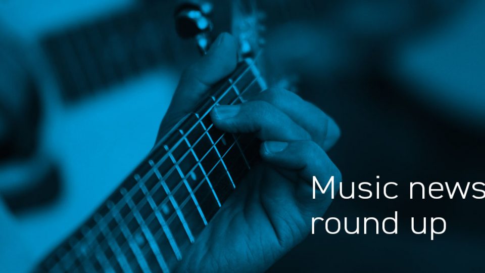 A news header with a close up of an acoustic guitar and the text: "Music news round up"