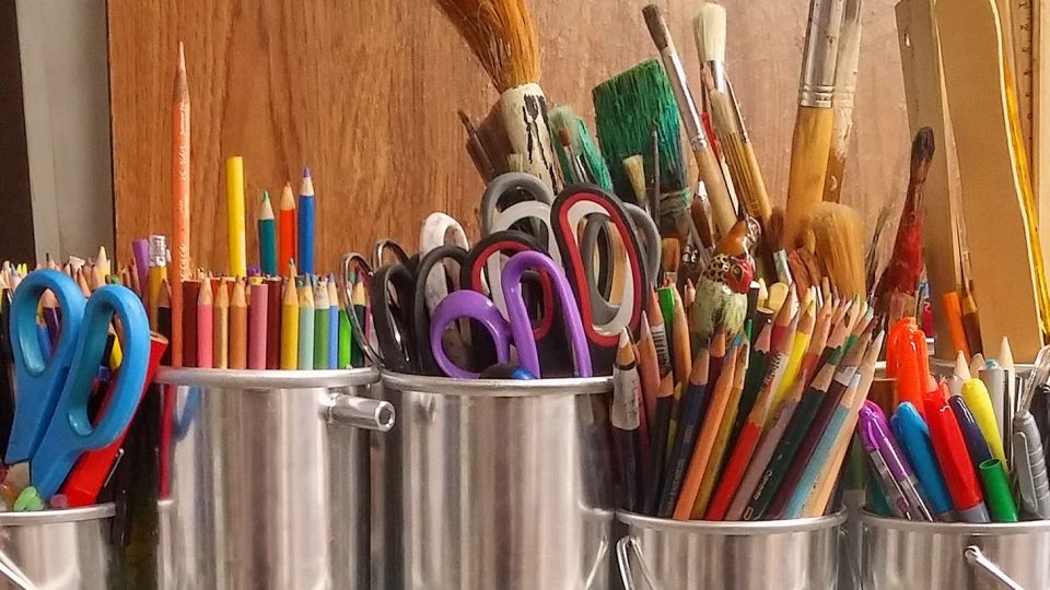 Pots of pencils and pens for crafts