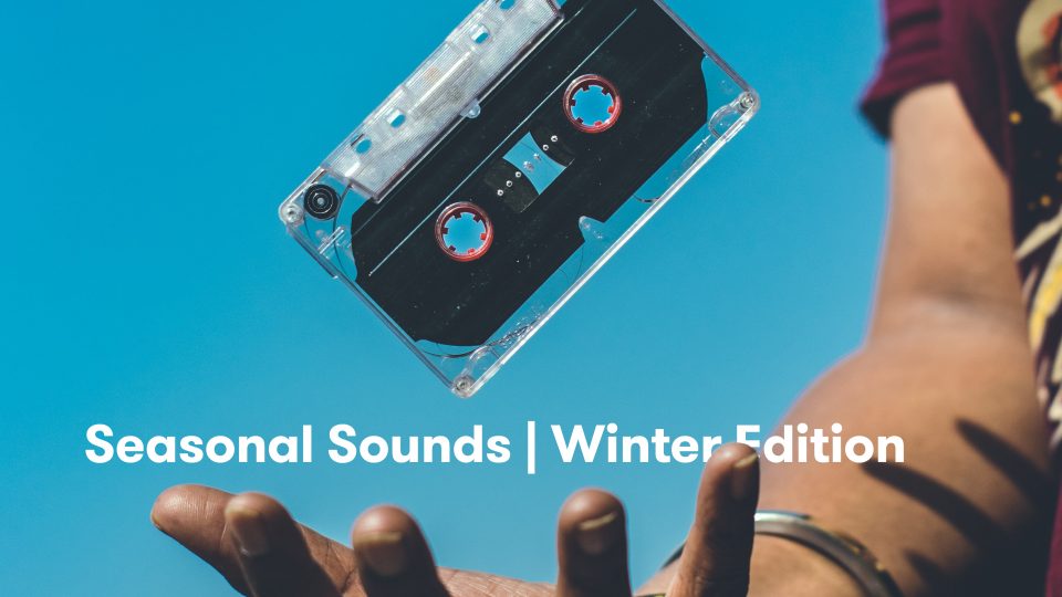 A white person throwing a cassette tape with the text: "Seasonal Sounds | Winter Edition" and a blue sky background