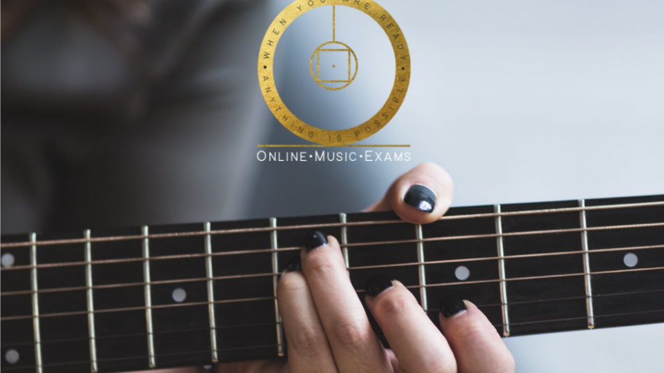 A promotion for online music exams with a close up of someone playing an acoustic guitar.