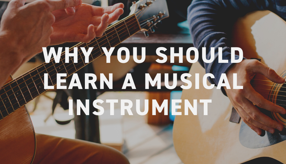 An image of two people playing acoustic guitars with the text: "Why you should learn a musical instrument"