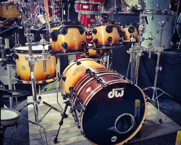 A yellow to brown ombre drumkit, on display in the Rockem Music shop